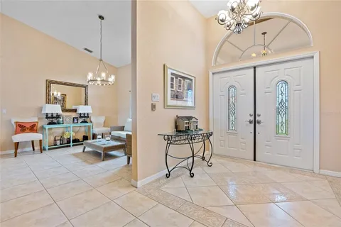 a view of a livingroom with furniture and a chandelier