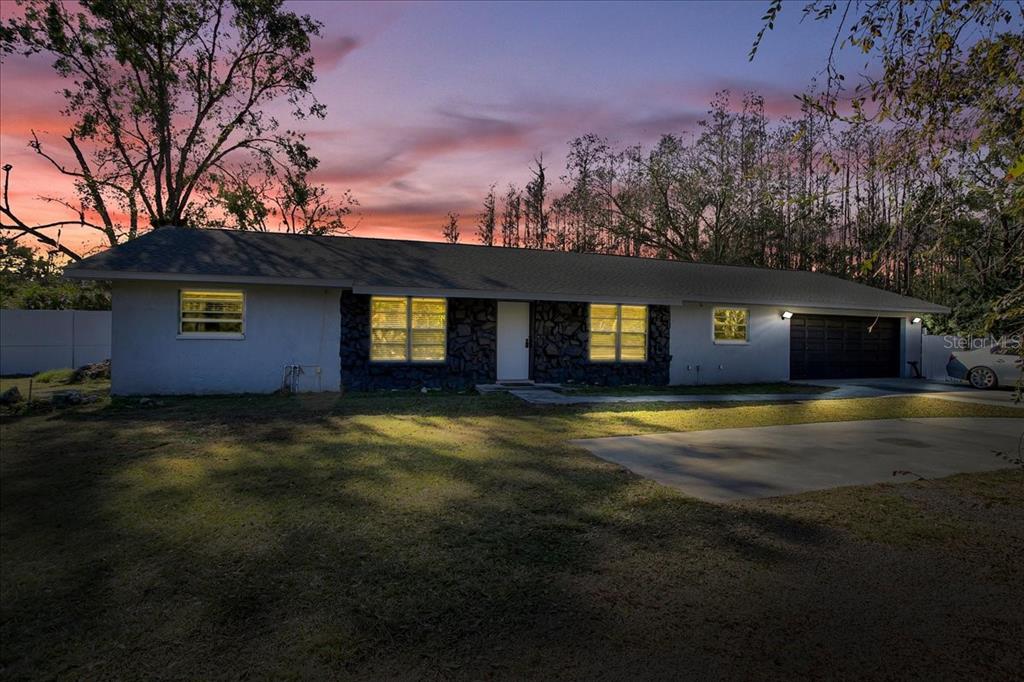 6124 Lynn Road Tampa, FL 33625 - Photo 2 of 84 a front view of a house with a yard