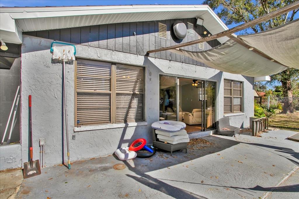 6124 Lynn Road Tampa, FL 33625 - Photo 32 of 84 a living room with furniture a window and gym equipment