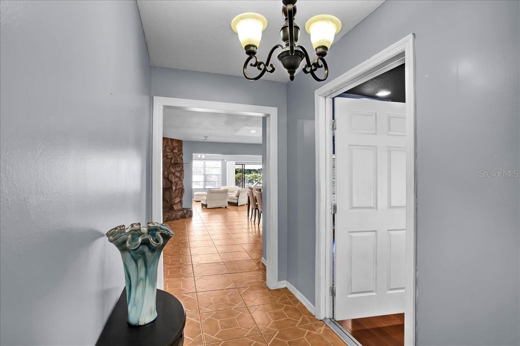 6124 Lynn Road Tampa, FL 33625 - Photo 37 of 84 a view of a hallway with chandelier and a chandelier