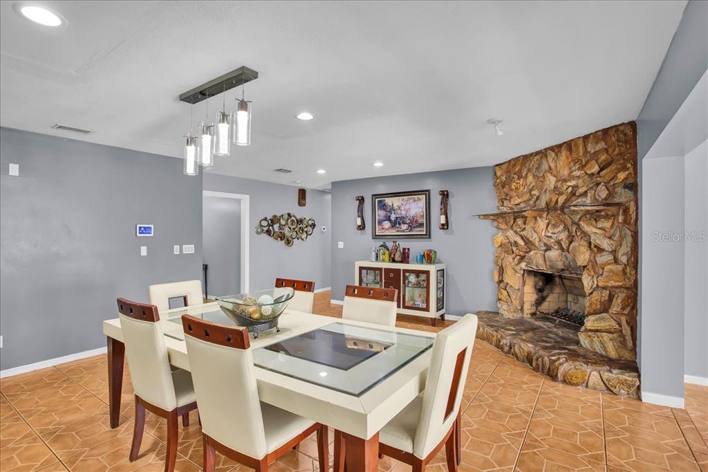 6124 Lynn Road Tampa, FL 33625 - Photo 41 of 84 a dining room with furniture and window