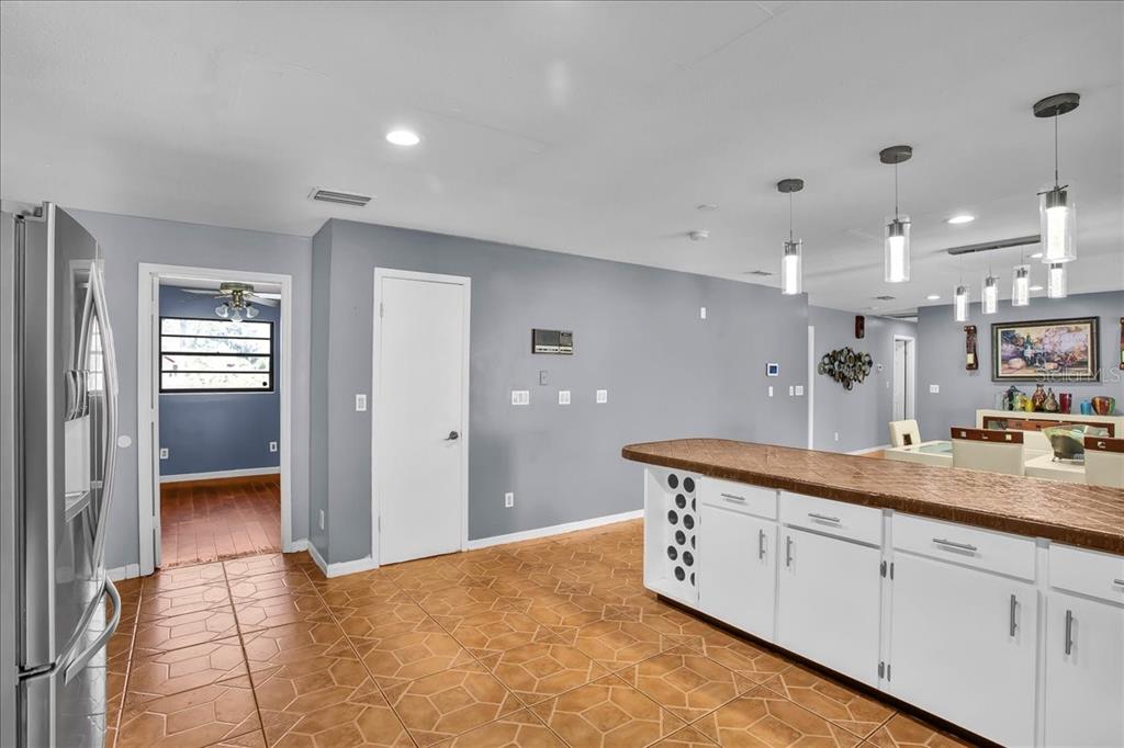 6124 Lynn Road Tampa, FL 33625 - Photo 47 of 84 a spacious bathroom with a granite countertop sink a mirror and a shower