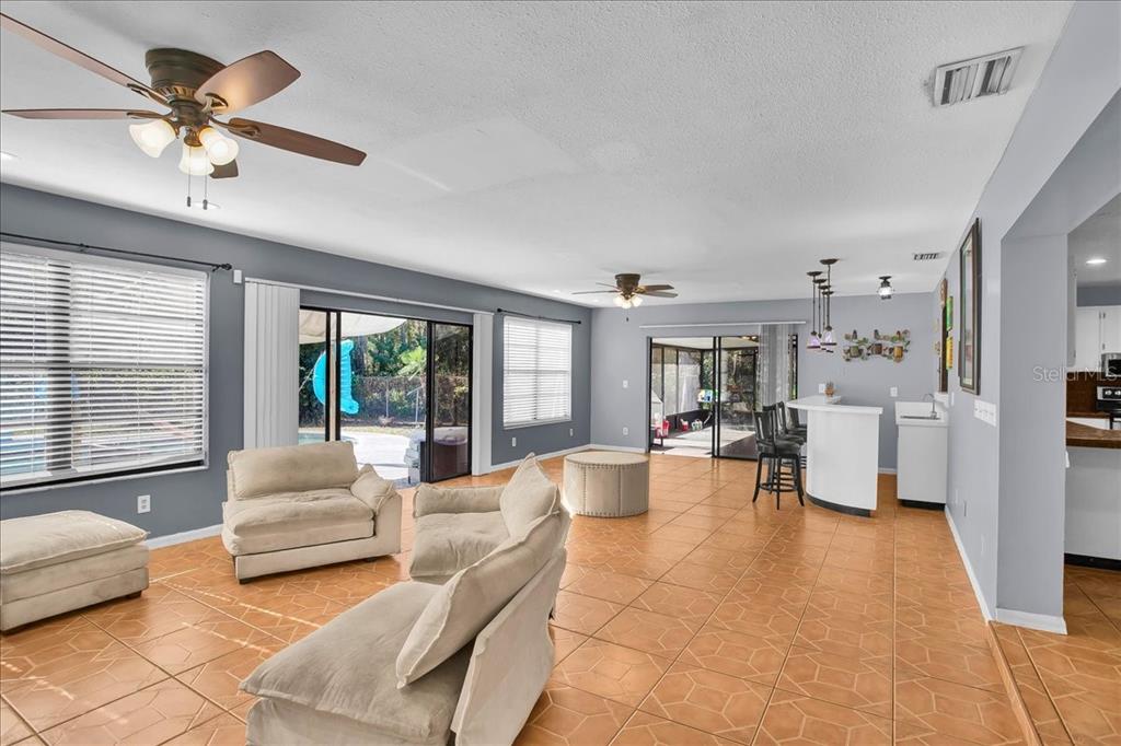 6124 Lynn Road Tampa, FL 33625 - Photo 48 of 84 a living room with furniture and large windows