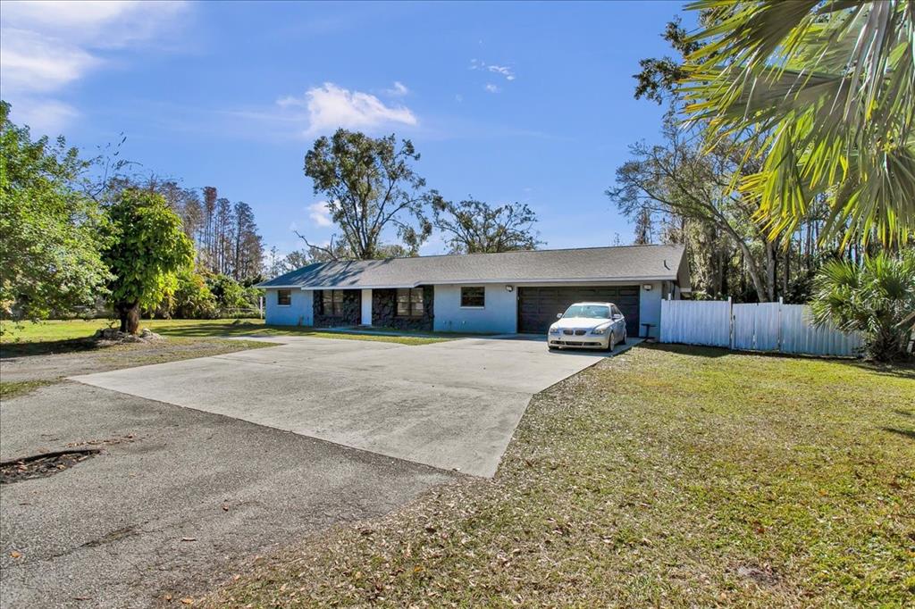 6124 Lynn Road Tampa, FL 33625 - Photo 5 of 84 a front view of a house with a yard and garage