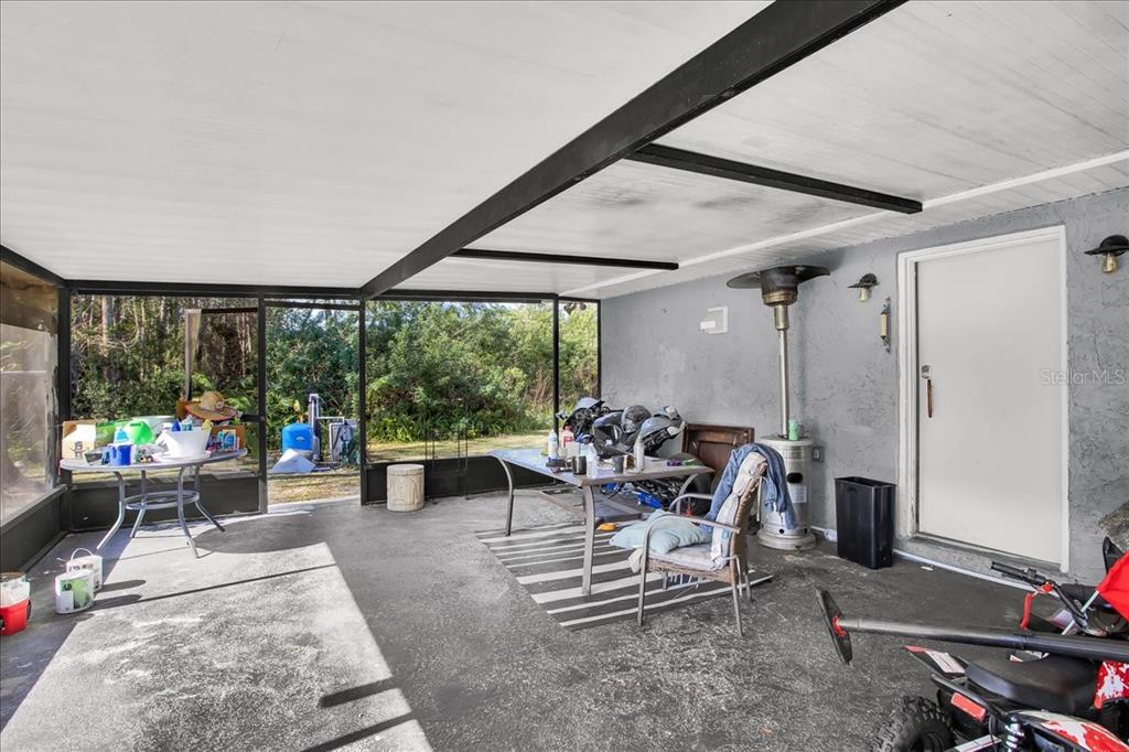 6124 Lynn Road Tampa, FL 33625 - Photo 53 of 84 a living room with furniture and large windows