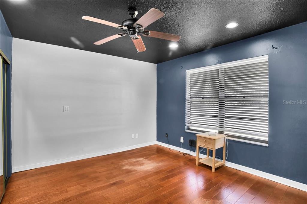6124 Lynn Road Tampa, FL 33625 - Photo 64 of 84 an empty room with a window and a ceiling fan