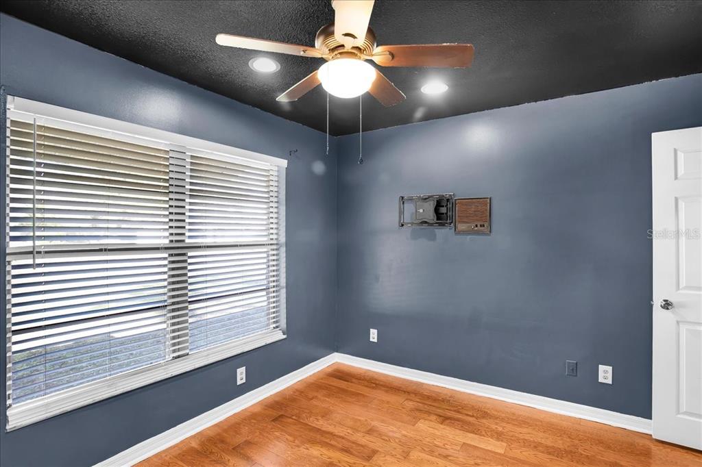 6124 Lynn Road Tampa, FL 33625 - Photo 67 of 84 en empty room with window and chandelier fan