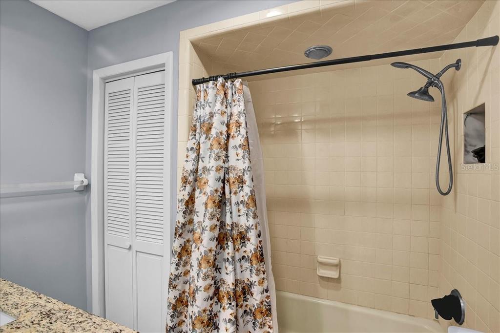 6124 Lynn Road Tampa, FL 33625 - Photo 69 of 84 a bathroom with a shower and a tub