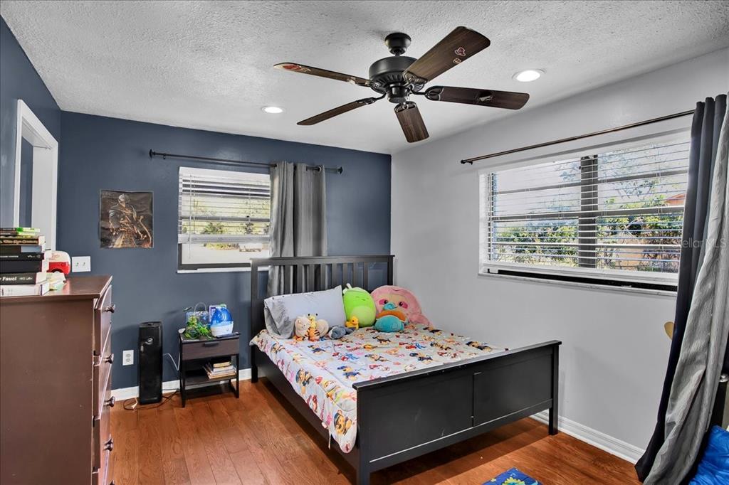 6124 Lynn Road Tampa, FL 33625 - Photo 72 of 84 a bedroom with a bed and a table in it