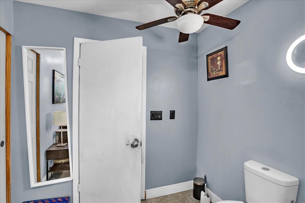 6124 Lynn Road Tampa, FL 33625 - Photo 82 of 84 a bathroom with a shower and a toilet