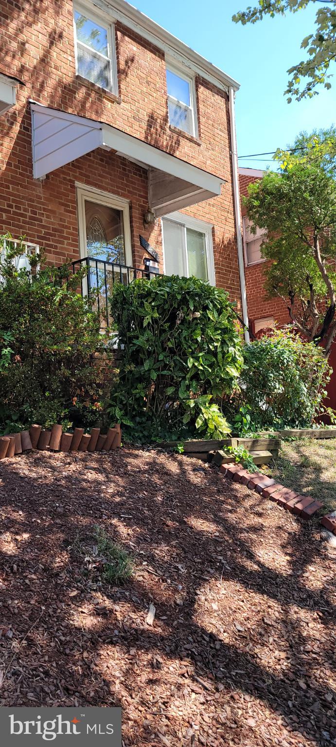 744 Hilltop Terrace Southeast Washington, DC 20019 - Photo 1 of 30 a front view of a house with garden