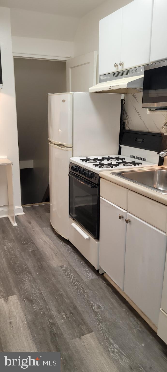 744 Hilltop Terrace Southeast Washington, DC 20019 - Photo 19 of 30 a view of a kitchen with electric appliances