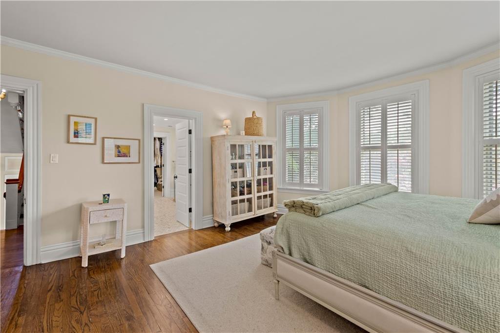 3 Beaver Street Sewickley, PA 15143 - Photo 13 of 40 a spacious bedroom with a bed and a table in it