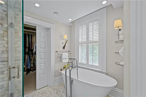 a bathroom with a tub and shower