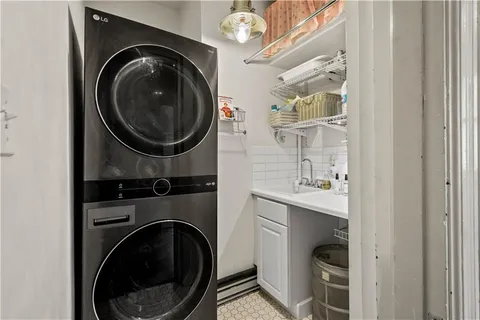 a close view of a utility room with dryer and washer