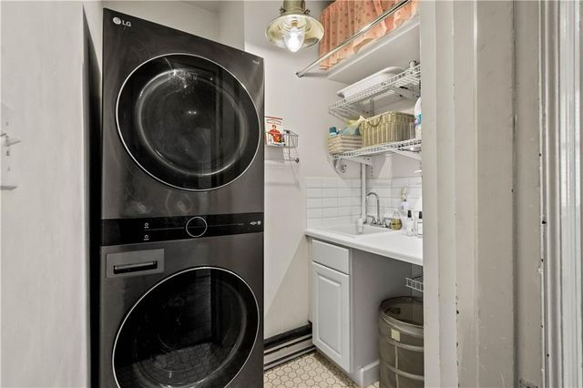 a close view of a utility room with dryer and washer