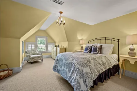 a bed room with a bed and a couch