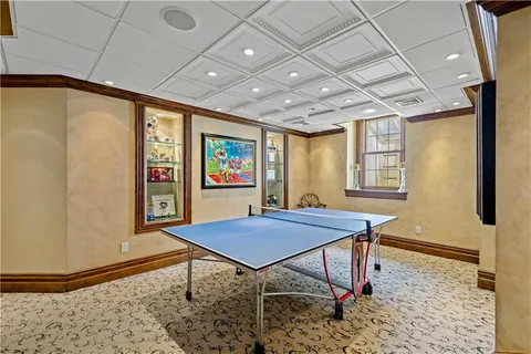 a view of a room with furniture and window