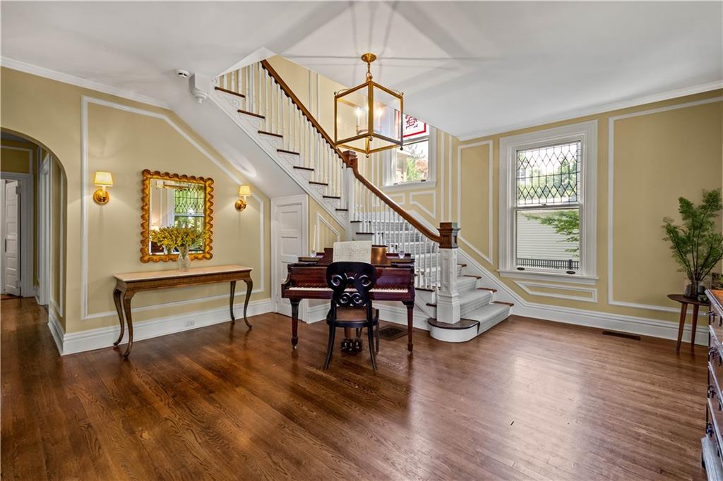 3 Beaver Street Sewickley, PA 15143 - Photo 4 of 40 a view of an entryway with wooden floor and stairs