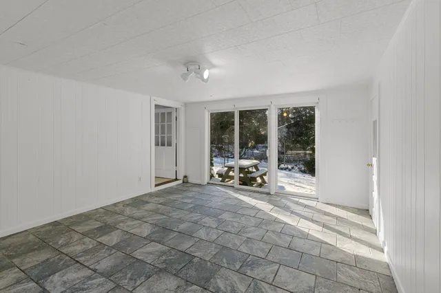 a view of an empty room with a window