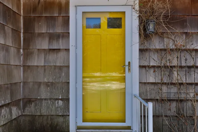 a view of a bathroom from a door