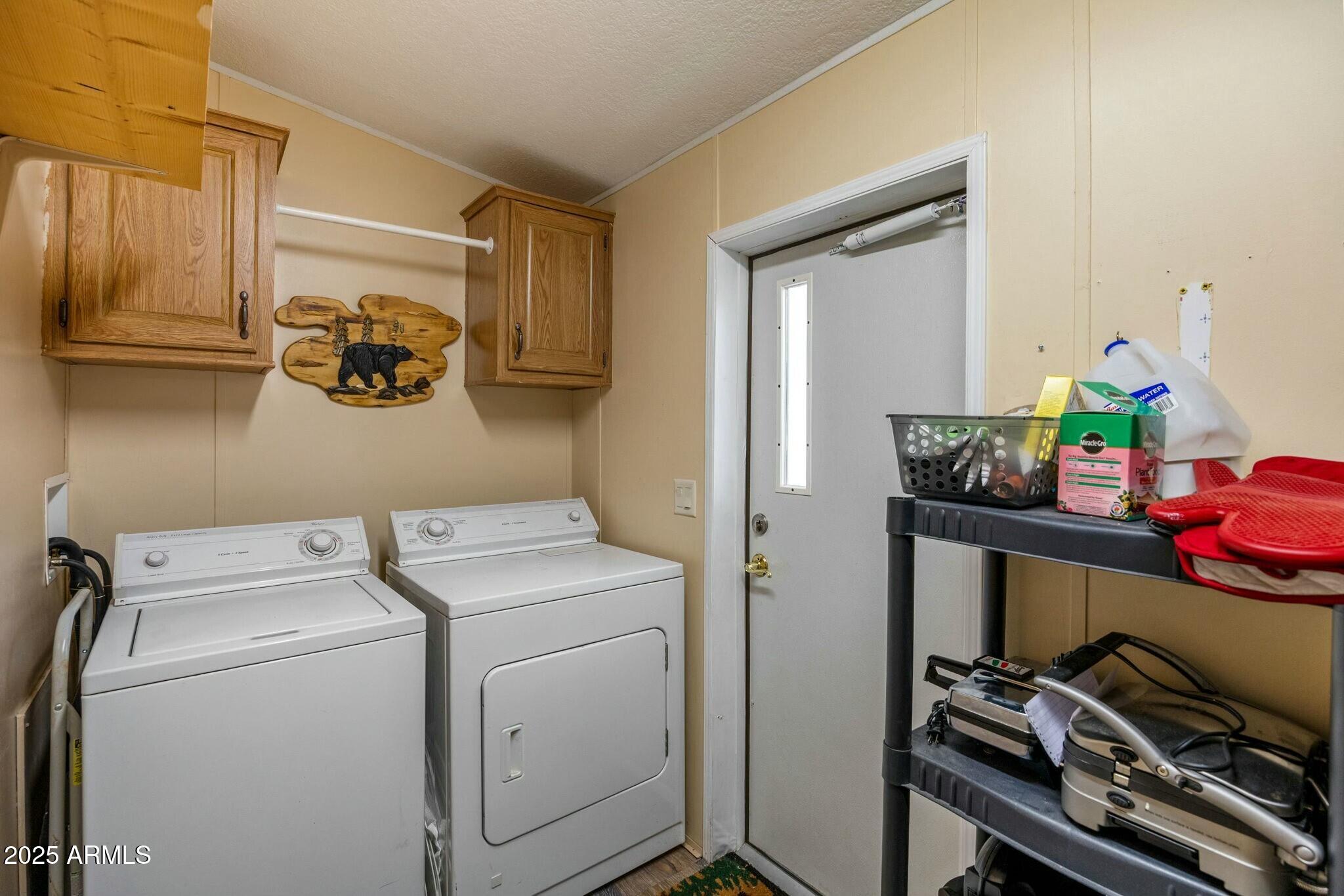 2893 Lazy Bear Trail Overgaard, AZ 85933 - Photo 21 of 34 a utility room with dryer and washer