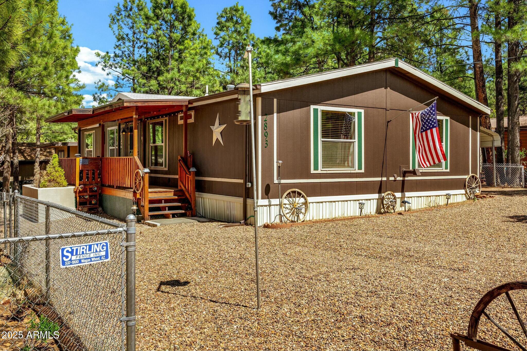 2893 Lazy Bear Trail Overgaard, AZ 85933 - Photo 32 of 34 a backyard of a house with shaded area