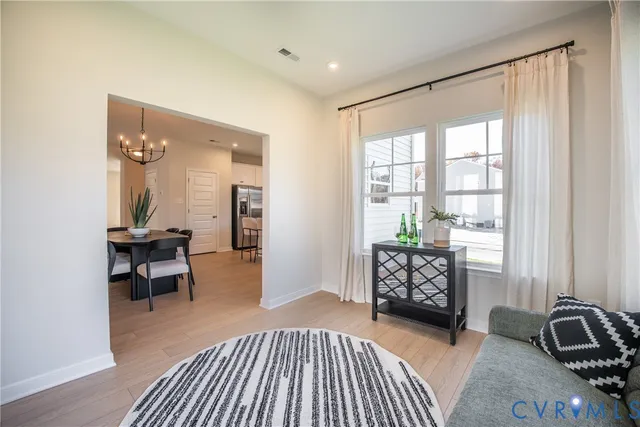 a bedroom with furniture and a window