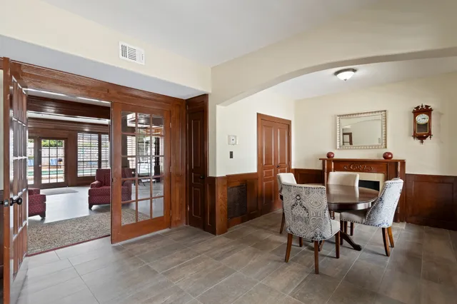 a view of a livingroom with furniture and a window