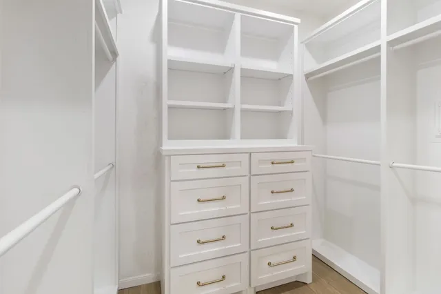 a view of an empty walk in closet