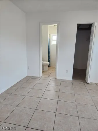 a bath tub sitting next to a white sink