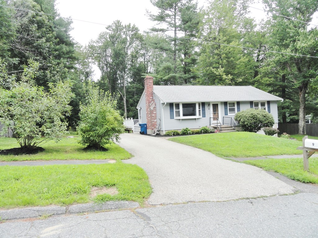 9 Edith Lane Rutland, MA 01543 - Photo 19 of 19 a front view of a house with a yard table and chairs