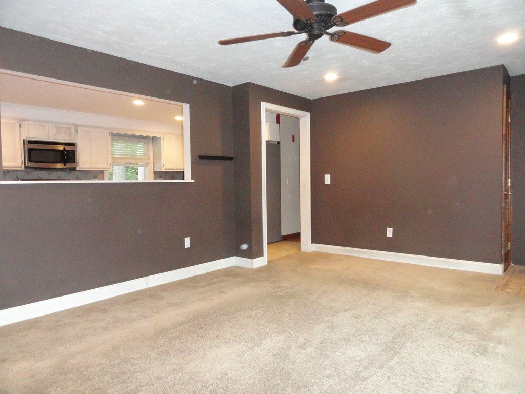 9 Edith Lane Rutland, MA 01543 - Photo 6 of 19 an empty room and chandelier fan