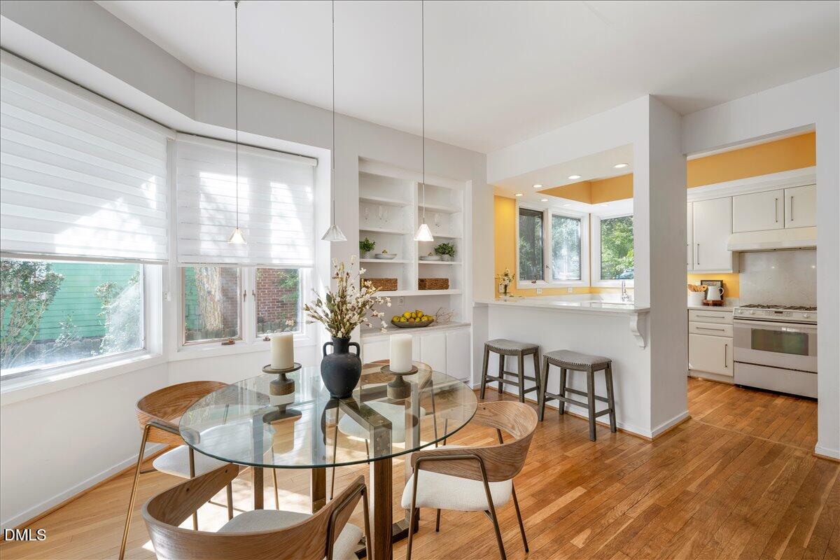530 Elm Street Raleigh, NC 27604 - Photo 15 of 47 a dining room with furniture and wooden floor