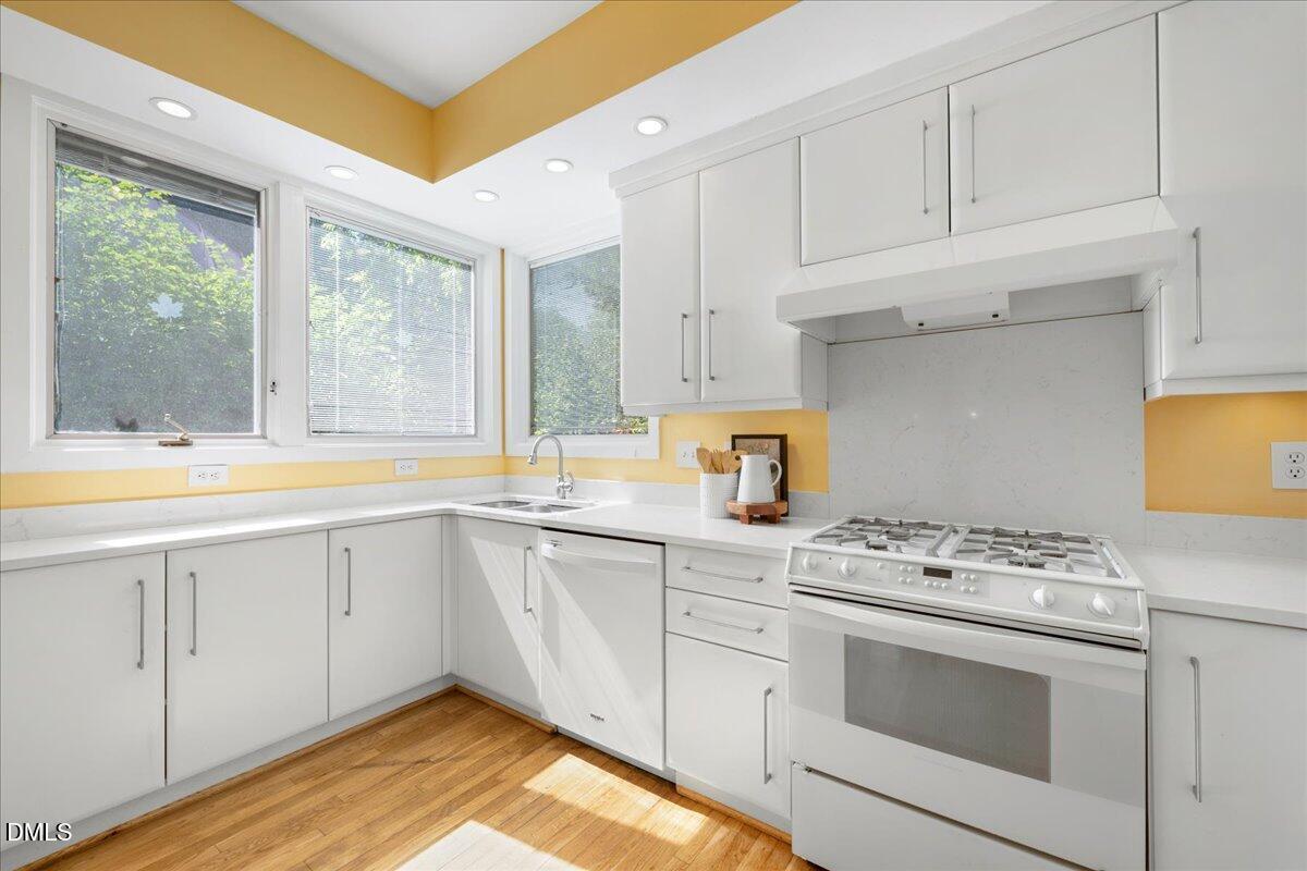 530 Elm Street Raleigh, NC 27604 - Photo 18 of 47 a kitchen with granite countertop a sink stainless steel appliances and cabinets