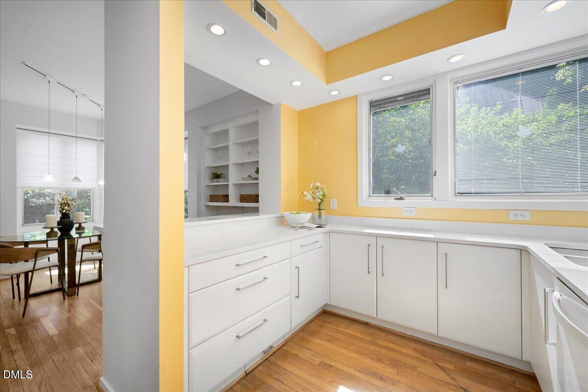 530 Elm Street Raleigh, NC 27604 - Photo 20 of 47 a view of a kitchen with a sink and a large window