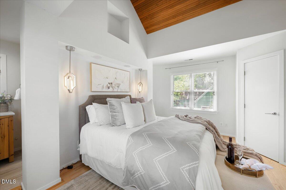530 Elm Street Raleigh, NC 27604 - Photo 27 of 47 a bedroom with a bed and a window