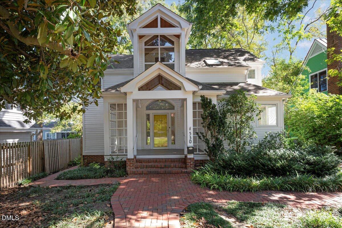 530 Elm Street Raleigh, NC 27604 - Photo 2 of 47 a front view of a house with a yard