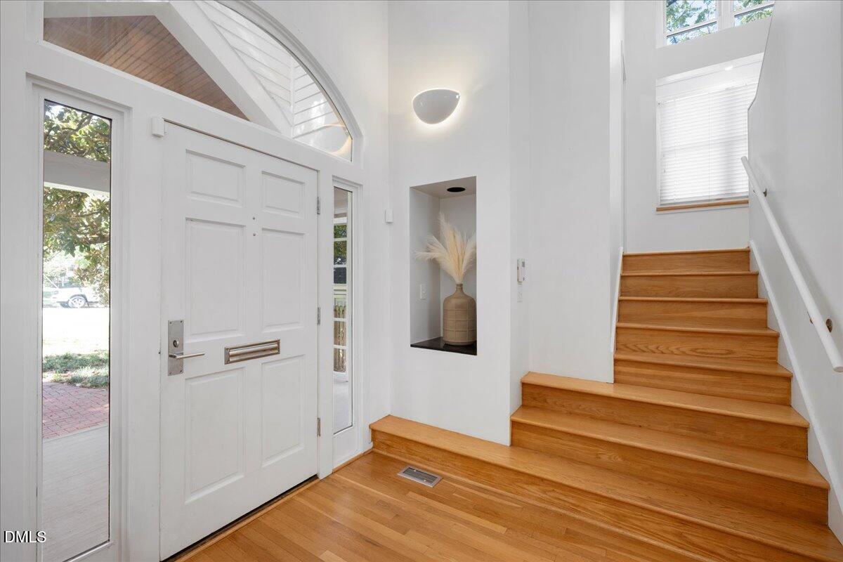 530 Elm Street Raleigh, NC 27604 - Photo 5 of 47 a view of an entryway with wooden floor and stairs