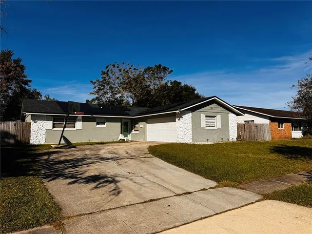a view of a yard and front view of a house