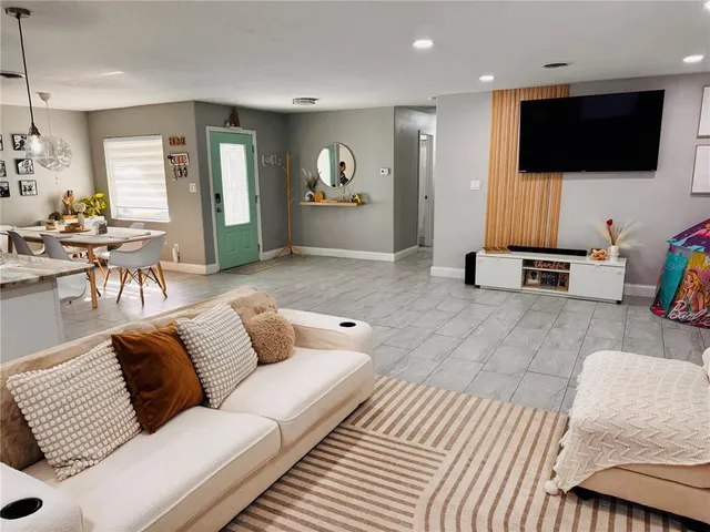 a living room with furniture and a window