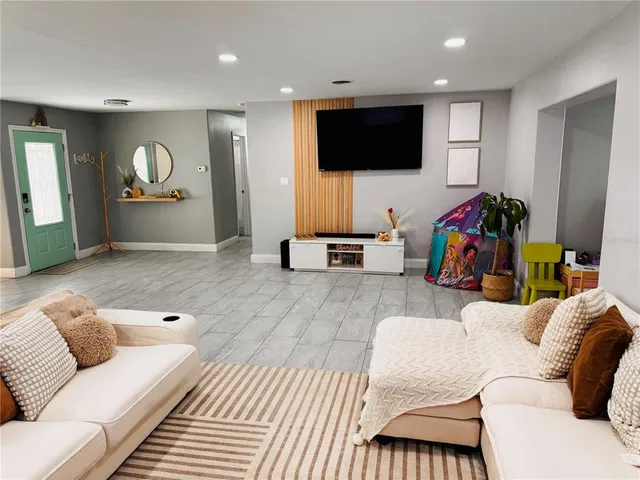 a living room with furniture and a window