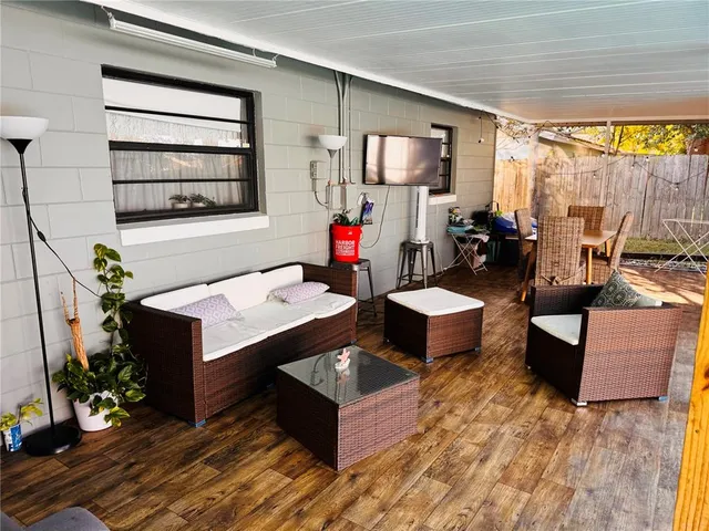 a living room with furniture and a window