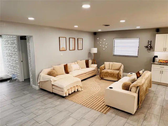 a living room with furniture and a window