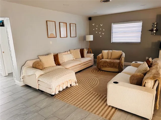 a living room with furniture and a couch