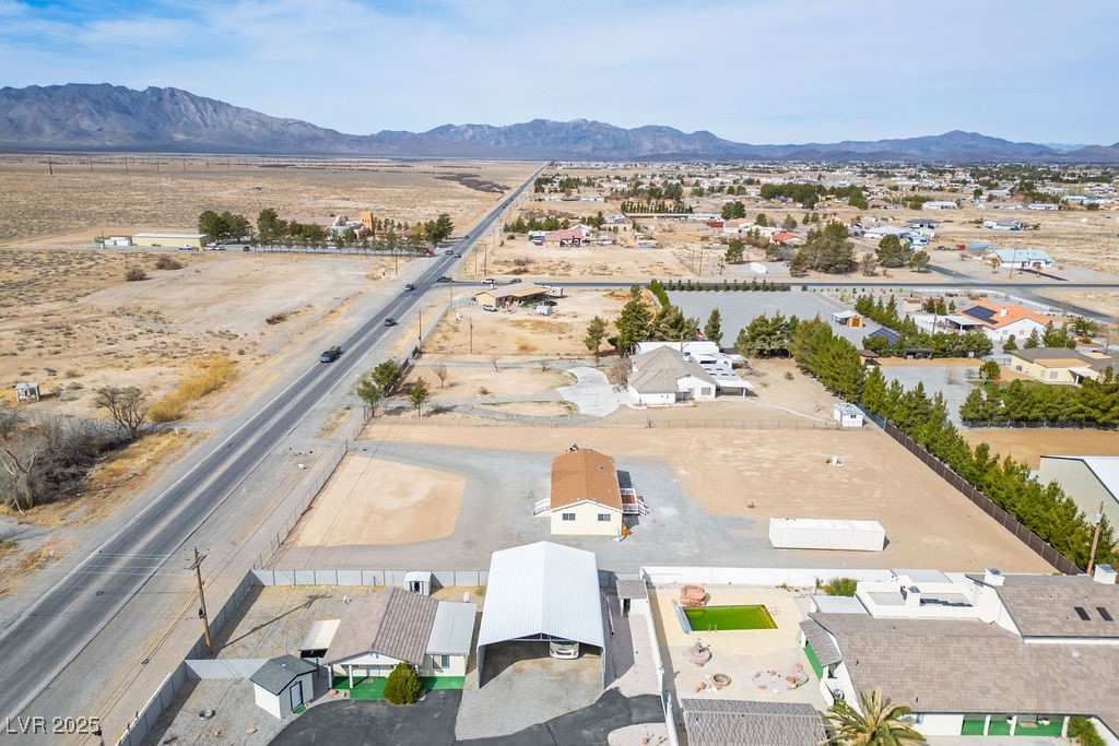 Bird's eye view featuring a desert view and a mountain view