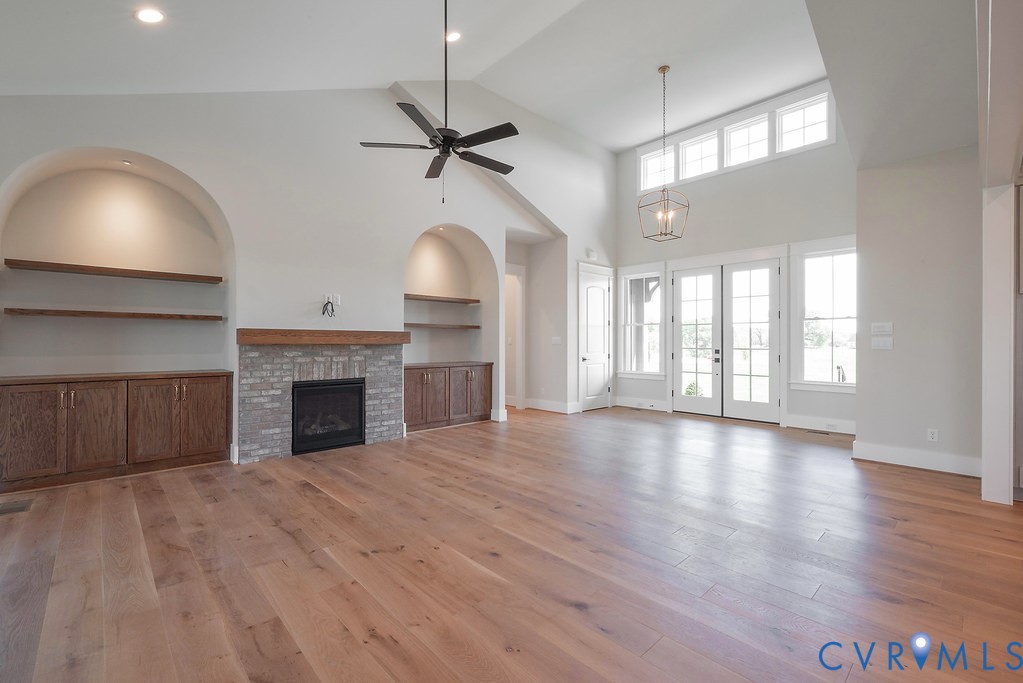 3530 Old Gun Road West Midlothian, VA 23113 - Photo 11 of 50 a view of an empty room with a fireplace and a window