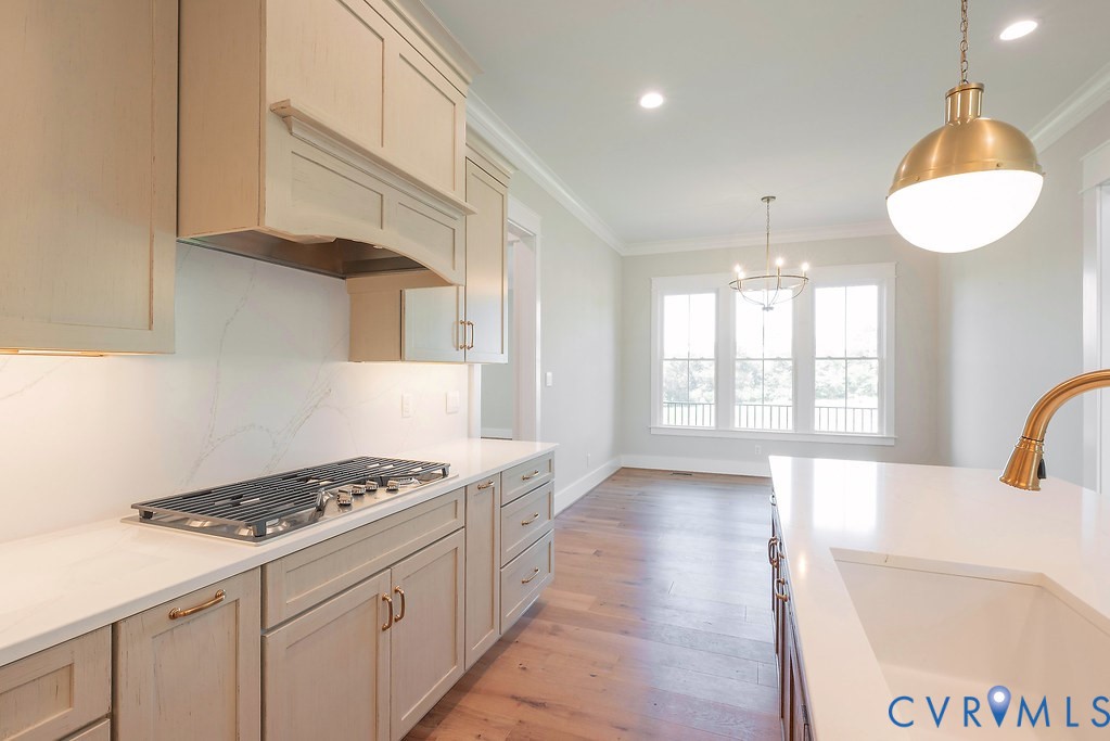 3530 Old Gun Road West Midlothian, VA 23113 - Photo 14 of 50 a kitchen with stainless steel appliances a stove a sink a refrigerator wooden floor and cabinets