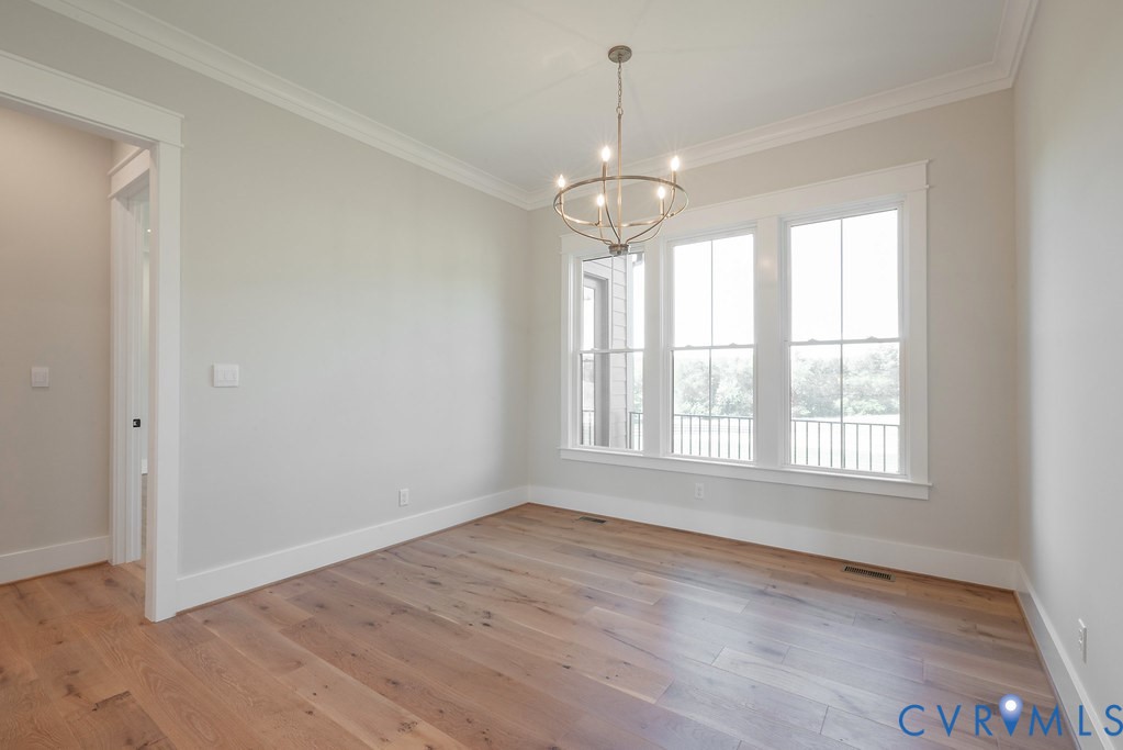 3530 Old Gun Road West Midlothian, VA 23113 - Photo 19 of 50 a view of an empty room with wooden floor and a window