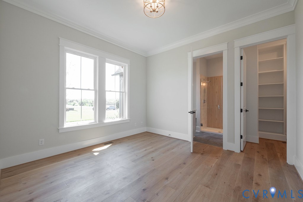 3530 Old Gun Road West Midlothian, VA 23113 - Photo 22 of 50 a view of an empty room with wooden floor and a window